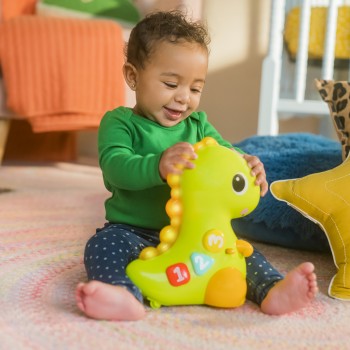 BRIGHT STARTS Hračka hudobná svetelná pohyblivá Dino, 6m+